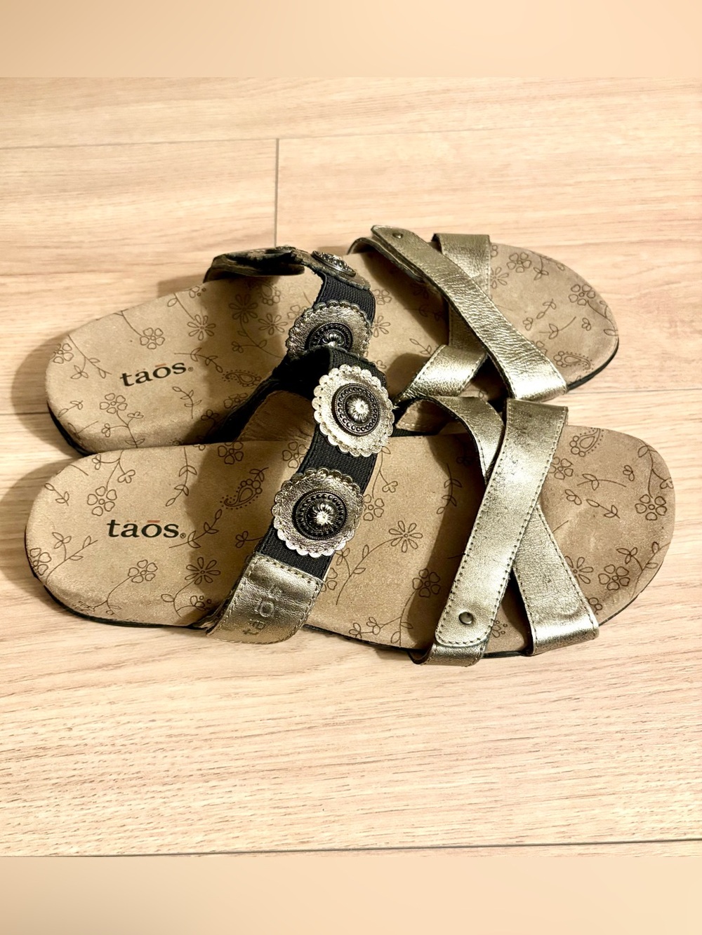 Taos Footwear metallic gold and black decorative slip-on sandals